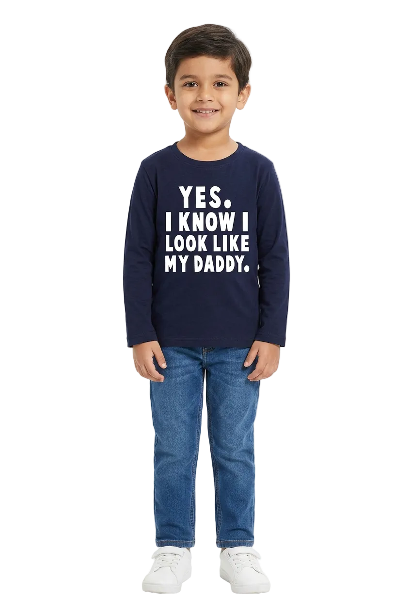 Boy wearing a navy full-sleeve slogan T-shirt on a white background.