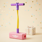 Pink foam pogo jumper in a pastel gift-themed setting