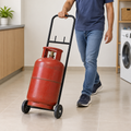 AI lifestyle illustration of a person moving an LPG cylinder with the black two-wheel trolley